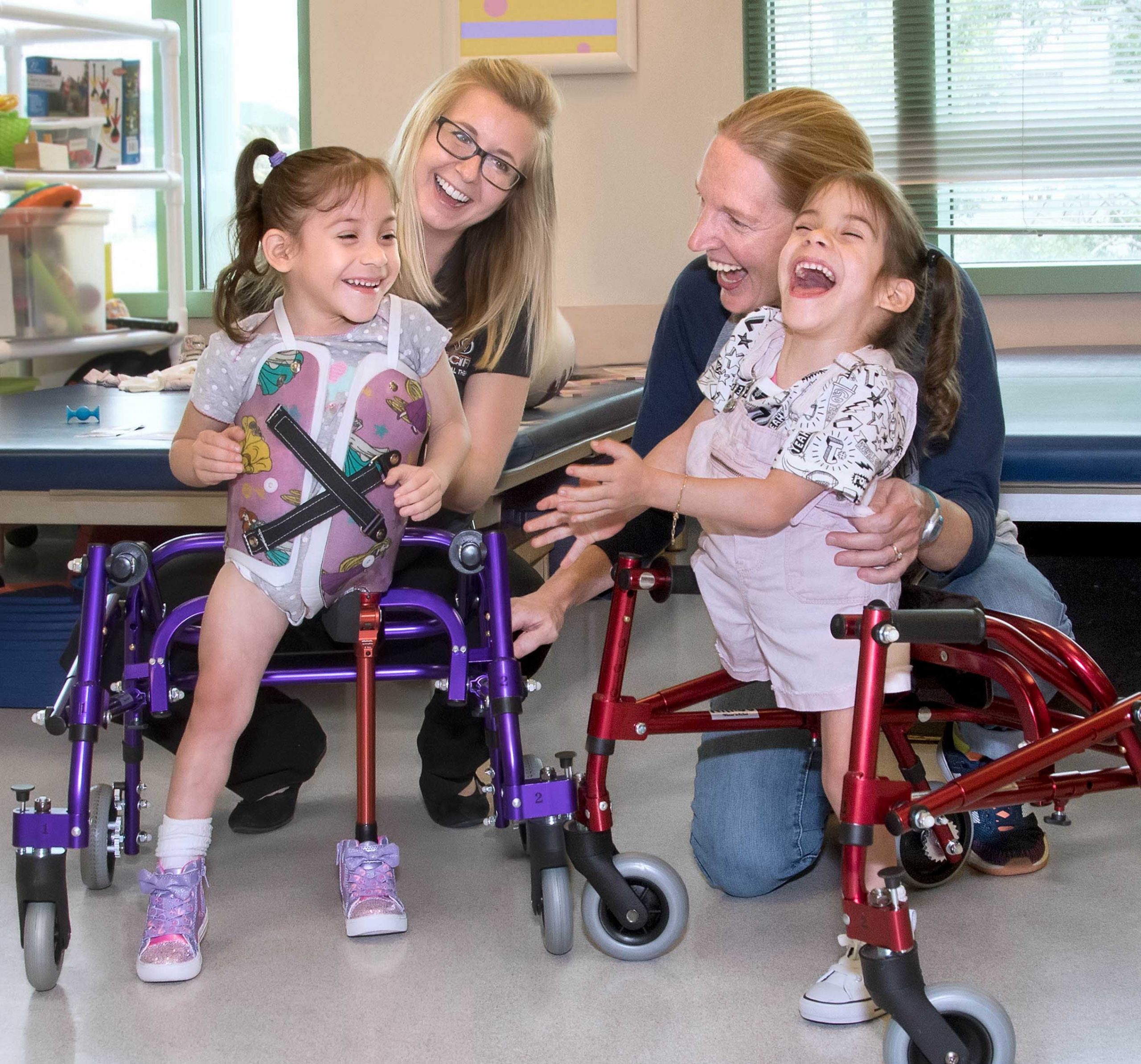 Eva and Erika - former conjoined twins smiling
