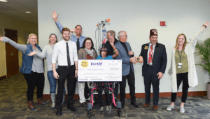 Shriners corporate partner Spirit Halloween poses with oversized check